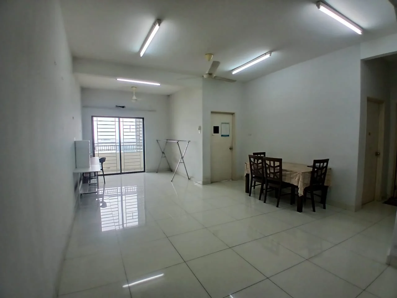 Room features: white painted walls, glossy white tile flooring, ceiling lights, ceiling fan, sliding glass door, window with view, dining table with four chairs, folding clothes drying rack; style: modern; view: city.